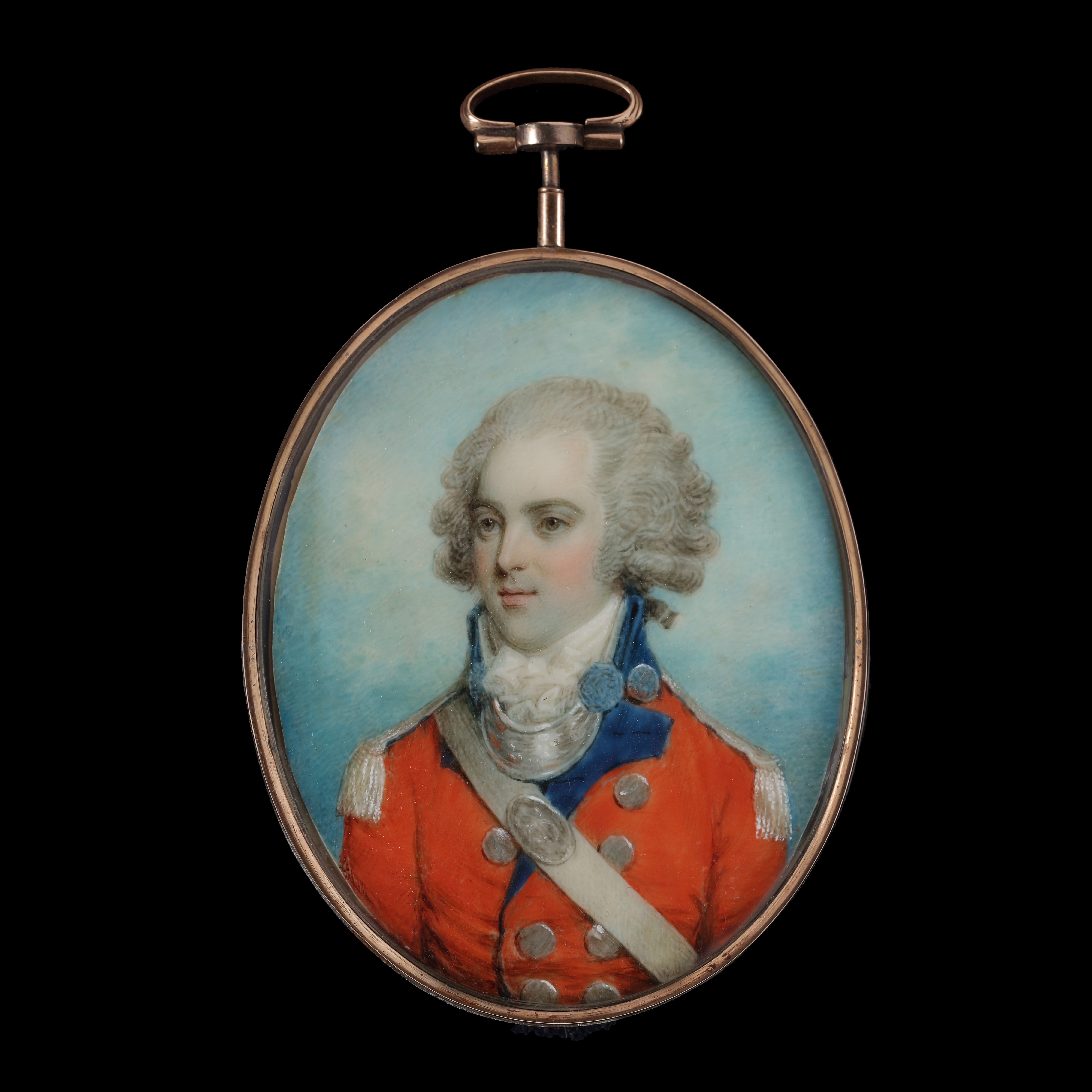 Portrait miniature of a Gentleman, traditionally called Peter de Bath, wearing officer’s  uniform, scarlet coat with blue facings, silver buttons, epaulettes, gorget, and shoulder- belt plate
